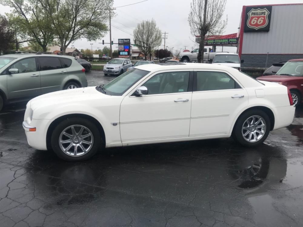 2006 White /Grey Chrysler 300C C (2C3KA63H56H) with an 5.7L V8 OHV 16V engine, 5-Speed Automatic Overdrive transmission, located at 813 E Fairview Ave, Meridian , ID, 83642, (208) 336-8230, 43.618851, -116.384010 - If you want a great car for cheap this is the one for you. Fully loaded runs and drives very nicely, come see for yourself. - Photo #0