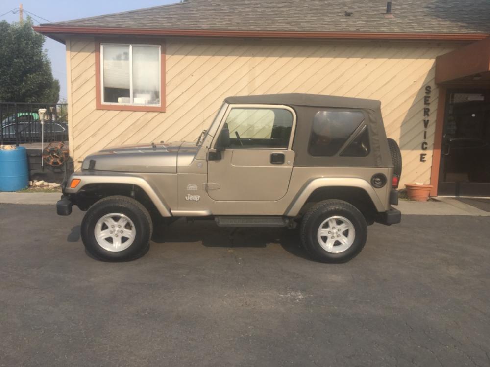 2004 Sandstone /Tan Jeep Wrangler Sahara (1J4FA59S64P) with an 4.0L L6 OHV 12V engine, AT transmission, located at 813 E Fairview Ave, Meridian , ID, 83642, (208) 336-8230, 43.618851, -116.384010 - Super clean, low mileage Wrangler, has A/C, AT and Cruise. If you want a nice stock clean low mileage Wrangler this is the one!!! - Photo #0