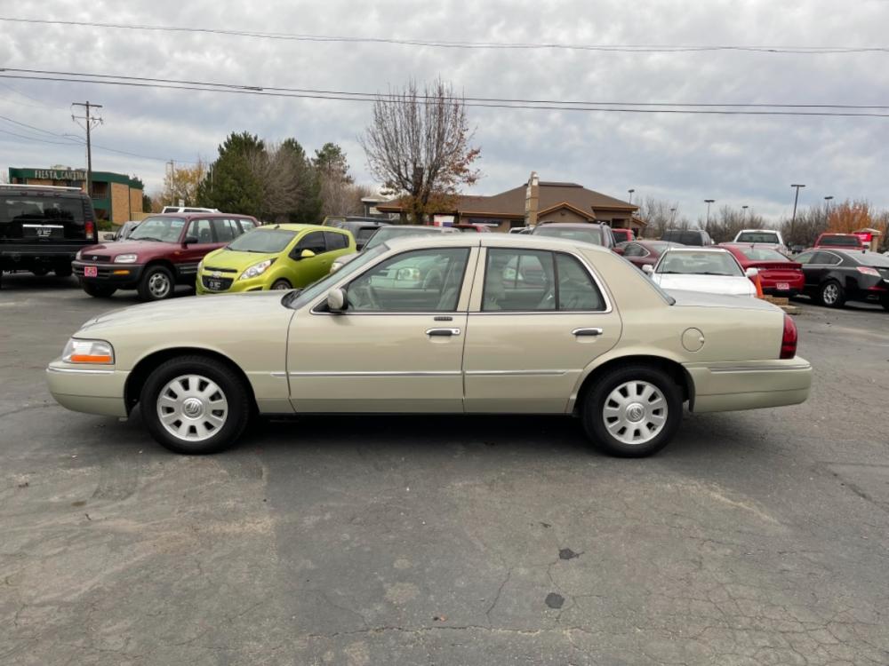 2005 Sandstone /Tan Mercury Grand Marquis LS Premium (2MEFM75W85X) with an 4.6L V8 OHC 16V engine, 4-Speed Automatic Overdrive transmission, located at 813 E Fairview Ave, Meridian , ID, 83642, (208) 336-8230, 43.618851, -116.384010 - If you want a good car with an accretional ride, gets 25+ MPG for cheap this is your new car. Check this thing out only 55k miles. This car is sooooo cool and comfy. It is a definite must see. - Photo #0