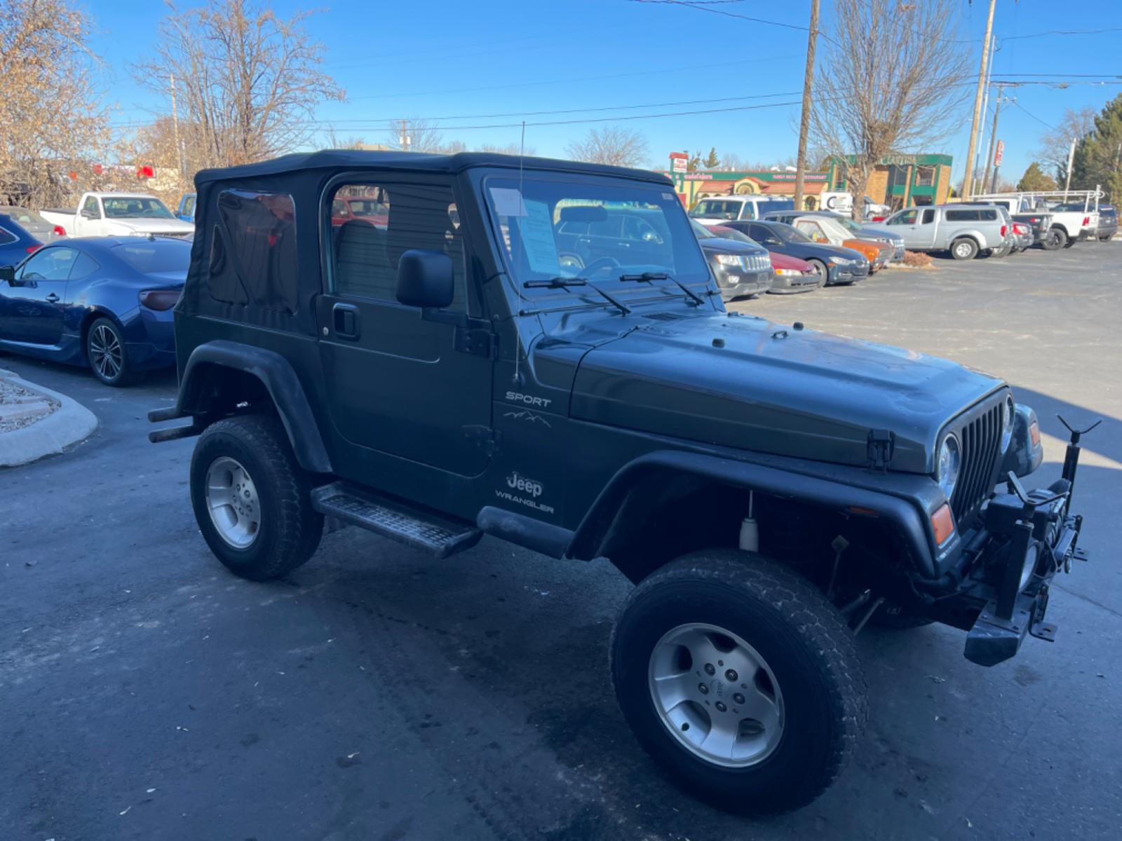 2004 Green /Grey Jeep Wrangler Sport (1J4FA49S94P) with an 4.0L L6 OHV 12V engine, AT transmission, located at 813 E Fairview Ave, Meridian , ID, 83642, (208) 336-8230, 43.618851, -116.384010 - Photo #4