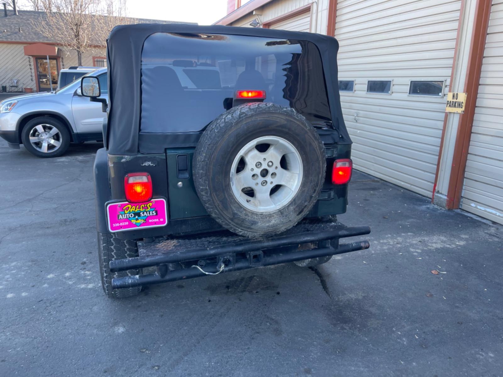 2004 Green /Grey Jeep Wrangler Sport (1J4FA49S94P) with an 4.0L L6 OHV 12V engine, AT transmission, located at 813 E Fairview Ave, Meridian , ID, 83642, (208) 336-8230, 43.618851, -116.384010 - Photo #5