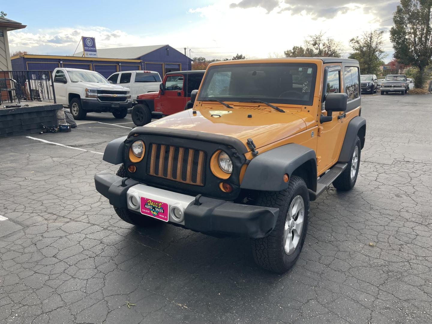 2012 Orange /Black Jeep Wrangler Sport 4WD (1C4AJWAG0CL) with an 3.6L V6 DOHC 24V FFV engine, 6-Speed Manual transmission, located at 813 E Fairview Ave, Meridian , ID, 83642, (208) 336-8230, 43.618851, -116.384010 - Photo#2