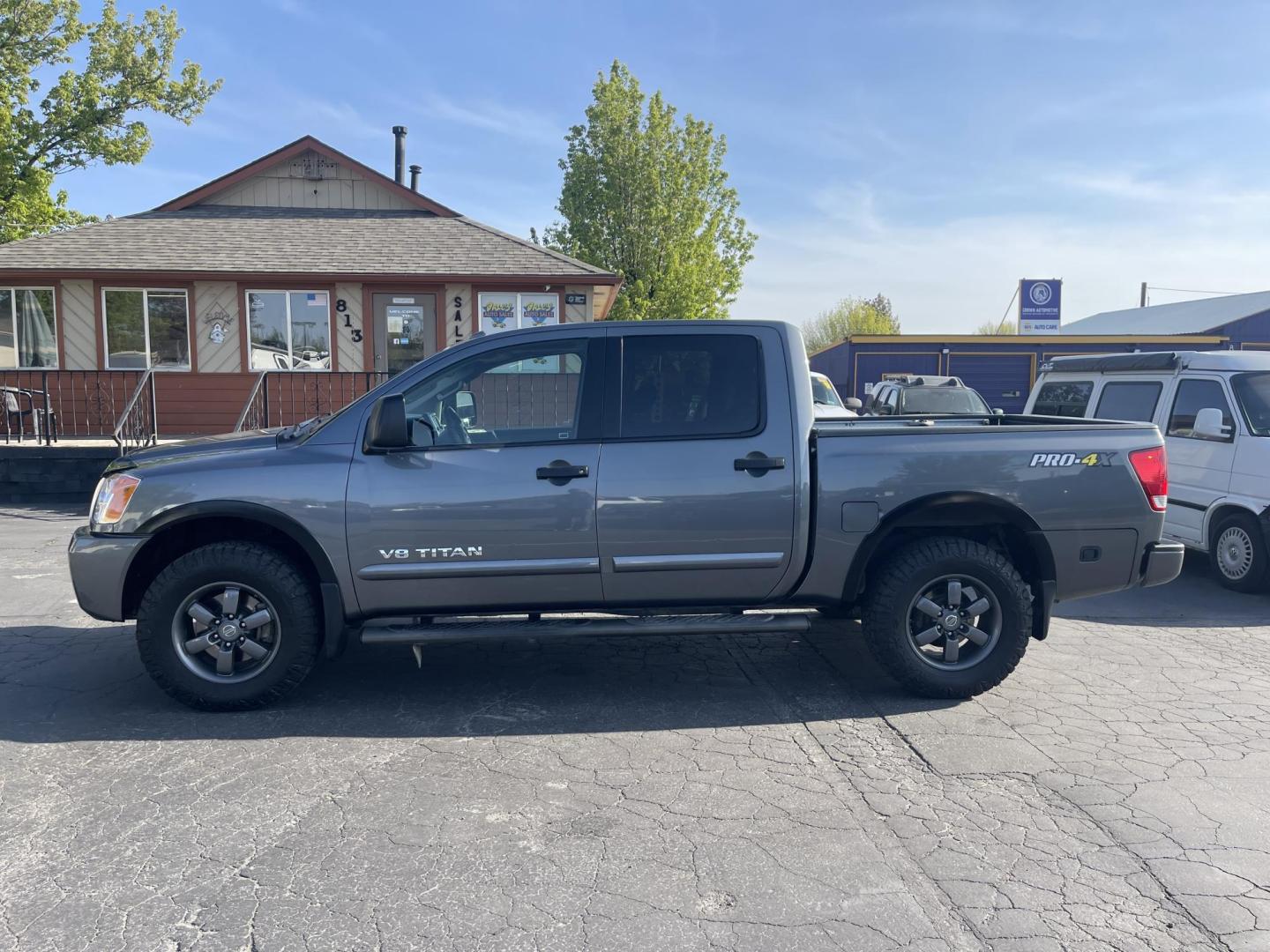 2013 Grey /Black Nissan Titan PRO-4X Crew Cab 4WD SWB (1N6AA0EC9DN) with an 5.6L V8 DOHC 32V engine, 5-Speed Automatic transmission, located at 813 E Fairview Ave, Meridian , ID, 83642, (208) 336-8230, 43.618851, -116.384010 - Photo#0