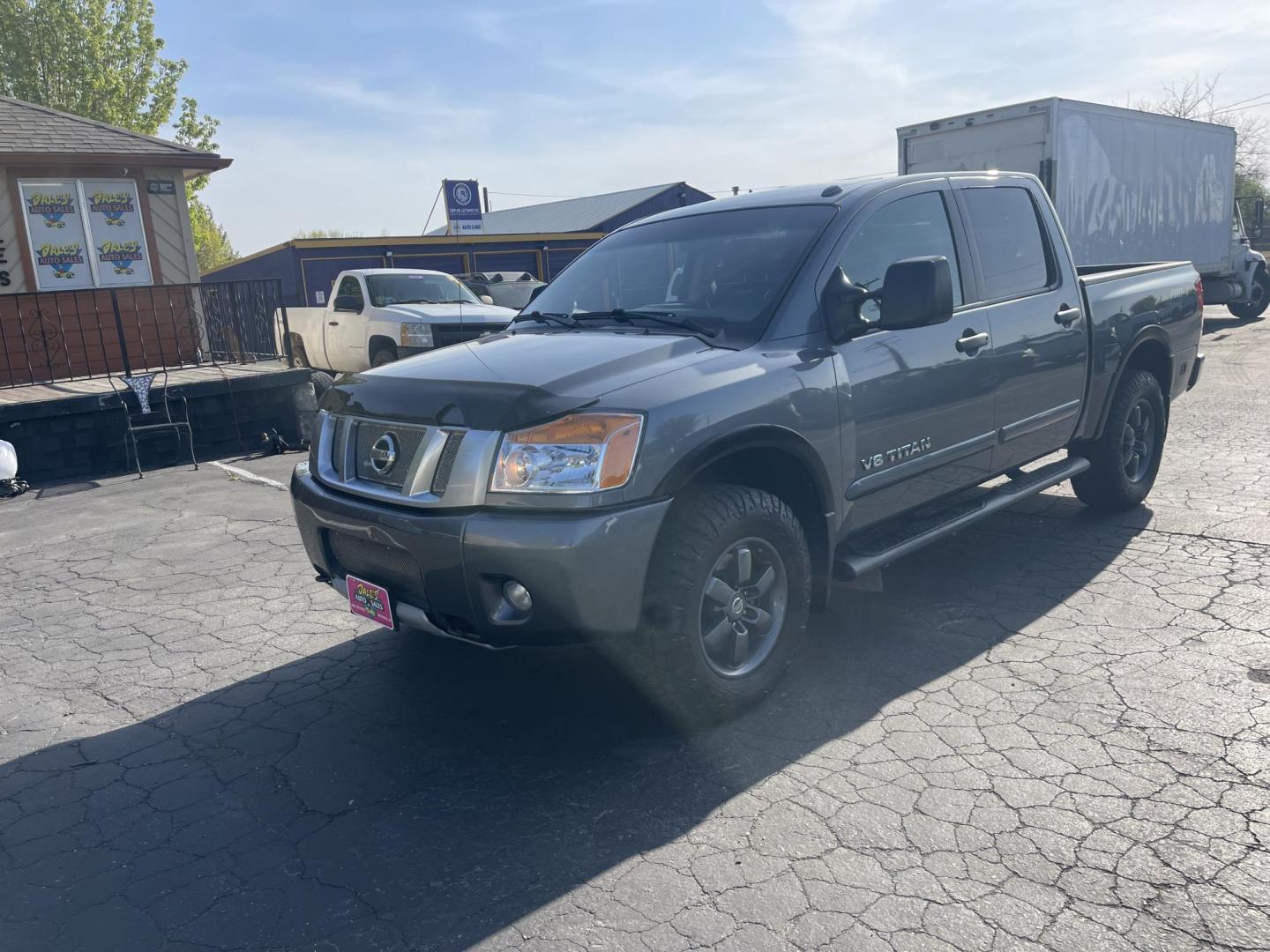 2013 Grey /Black Nissan Titan PRO-4X Crew Cab 4WD SWB (1N6AA0EC9DN) with an 5.6L V8 DOHC 32V engine, 5-Speed Automatic transmission, located at 813 E Fairview Ave, Meridian , ID, 83642, (208) 336-8230, 43.618851, -116.384010 - Photo#1