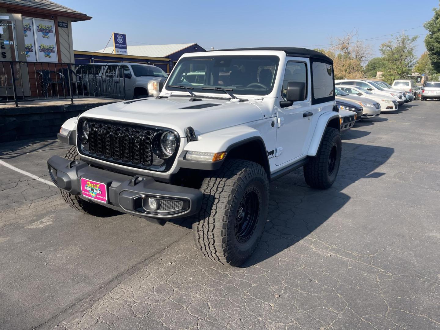 2024 White /Black Jeep Wrangler Willy's (1C4PJXAG0RW) with an 3.6L V6 DOHC 24V engine, 6M transmission, located at 813 E Fairview Ave, Meridian , ID, 83642, (208) 336-8230, 43.618851, -116.384010 - A very nice almost new Wrangler with lots of custom additions. Set of 5 matching Black Rhino wheels and Open Range AT tires that look spectacular. Rubicon Hood and Paint to match fender flares. K&N Cold Air Intake, and $3,000 Magnaflow Dual cat back exhaust. If you want a super cool Wrangler thi - Photo#1