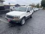 1999 White /Grey Jeep Grand Cherokee Laredo 4WD (1J4GW58N7XC) with an 4.7L V8 SOHC 16V engine, 4-Speed Automatic Overdrive transmission, located at 813 E Fairview Ave, Meridian , ID, 83642, (208) 336-8230, 43.618851, -116.384010 - Brand new engine 1100 miles ago, has a 3 year 36,000 mile transferable warranty. - Photo#1