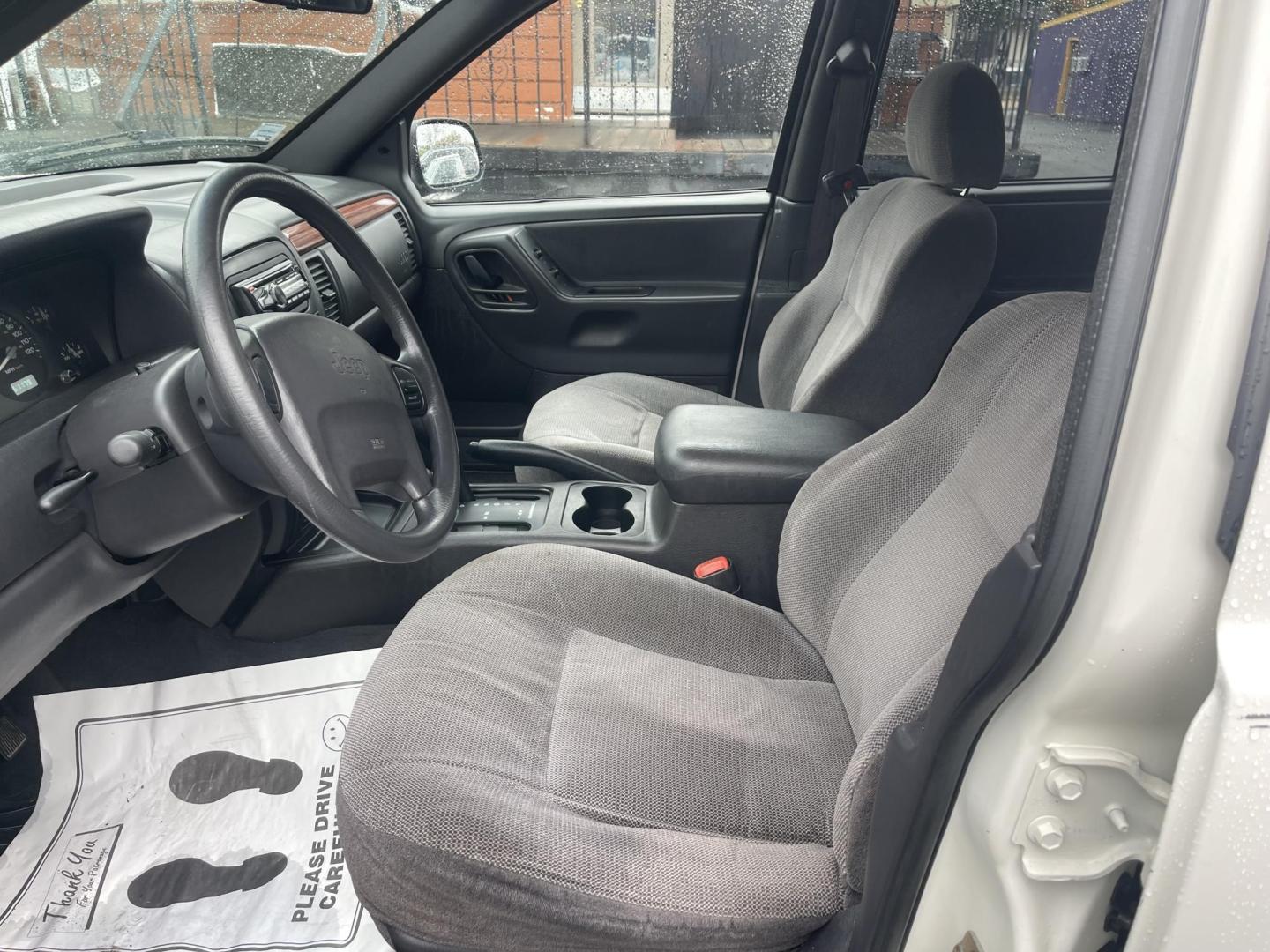 1999 White /Grey Jeep Grand Cherokee Laredo 4WD (1J4GW58N7XC) with an 4.7L V8 SOHC 16V engine, 4-Speed Automatic Overdrive transmission, located at 813 E Fairview Ave, Meridian , ID, 83642, (208) 336-8230, 43.618851, -116.384010 - Brand new engine 1100 miles ago, has a 3 year 36,000 mile transferable warranty. - Photo#6