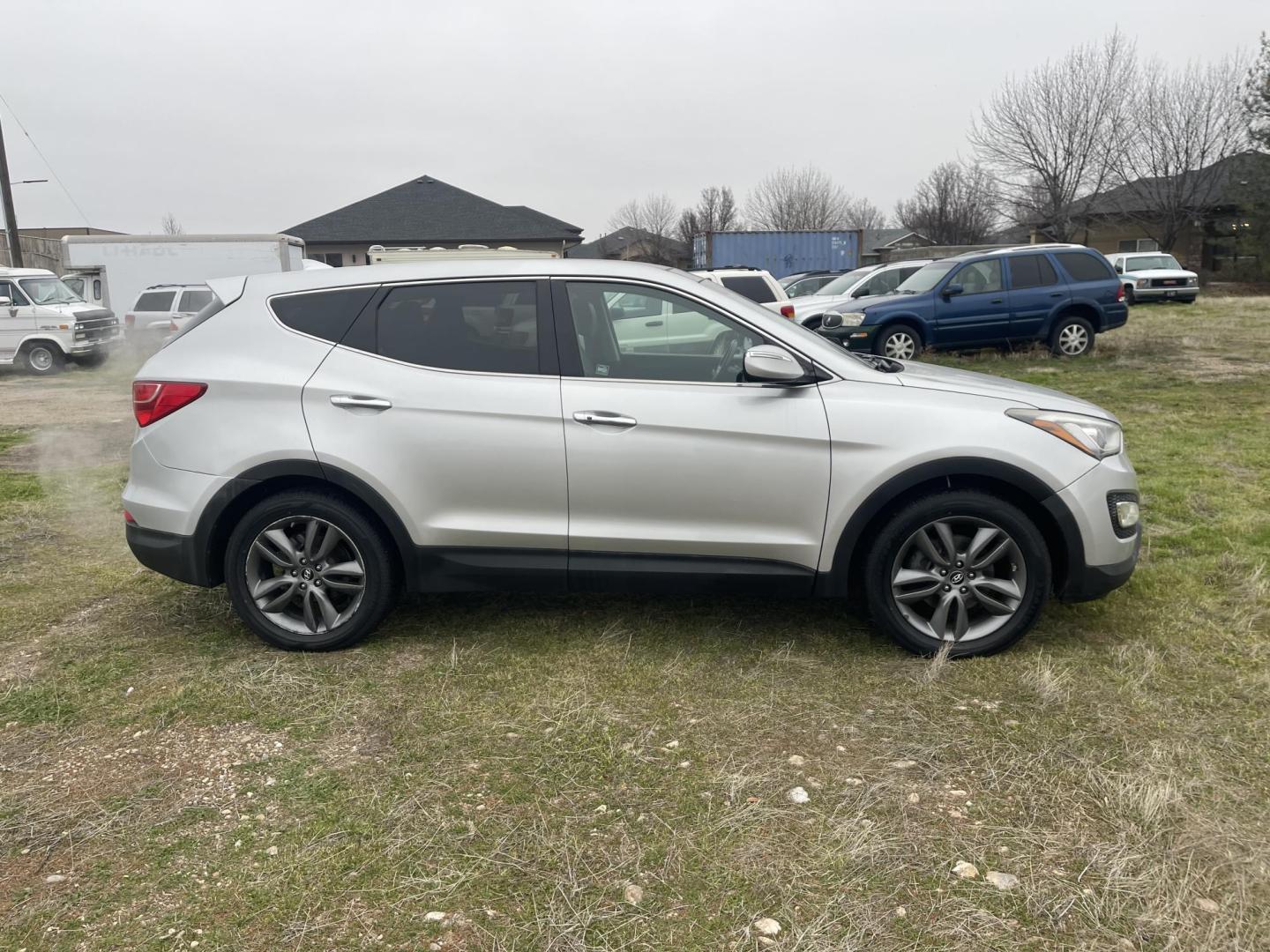 2013 Silver /Black Hyundai Santa Fe Sport 2.0 AWD (5XYZWDLA6DG) with an 2.0L L4 DOHC 16V engine, 6-Speed Automatic transmission, located at 813 E Fairview Ave, Meridian , ID, 83642, (208) 336-8230, 43.618851, -116.384010 - 2013 Hyundai Sante Fe Sport AWD. If you need a really good AWD vehicle for super cheap this is an excellent option. Take a look. This SUV has leather, Sunroof, NAV, and heated seats. A fantastic value. Come take a test drive. - Photo#3