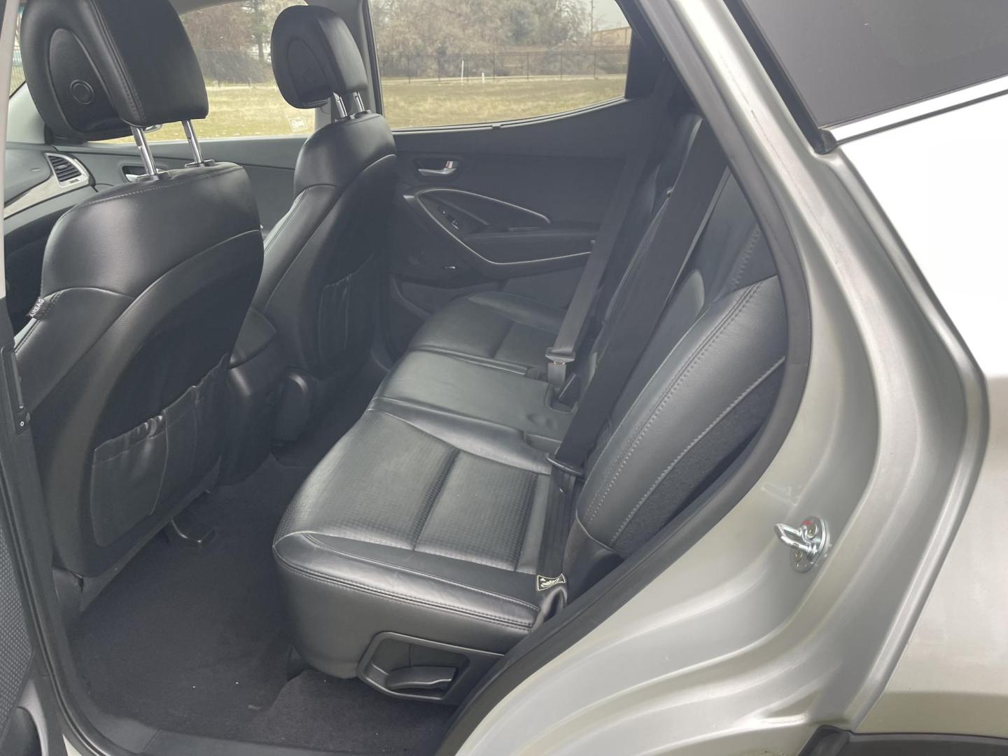 2013 Silver /Black Hyundai Santa Fe Sport 2.0 AWD (5XYZWDLA6DG) with an 2.0L L4 DOHC 16V engine, 6-Speed Automatic transmission, located at 813 E Fairview Ave, Meridian , ID, 83642, (208) 336-8230, 43.618851, -116.384010 - 2013 Hyundai Sante Fe Sport AWD. If you need a really good AWD vehicle for super cheap this is an excellent option. Take a look. This SUV has leather, Sunroof, NAV, and heated seats. A fantastic value. Come take a test drive. - Photo#7