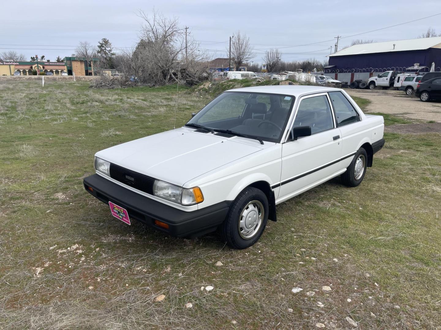 1989 White /Brown Nissan Sentra XE (JN1GB22S0KU) with an 1.6L L4 SOHC 12V engine, 5-Speed Manual Overdrive transmission, located at 813 E Fairview Ave, Meridian , ID, 83642, (208) 336-8230, 43.618851, -116.384010 - A one owner, super clean, always stored indoors, no cracks in the dash even, towels were on the seats when I got it, very very very nice unique older but spectacular vehicle. It has a 5spd with A/C that works perfectly, brand new Michellin tires. If you need a great little car for cheap this is yo - Photo#1