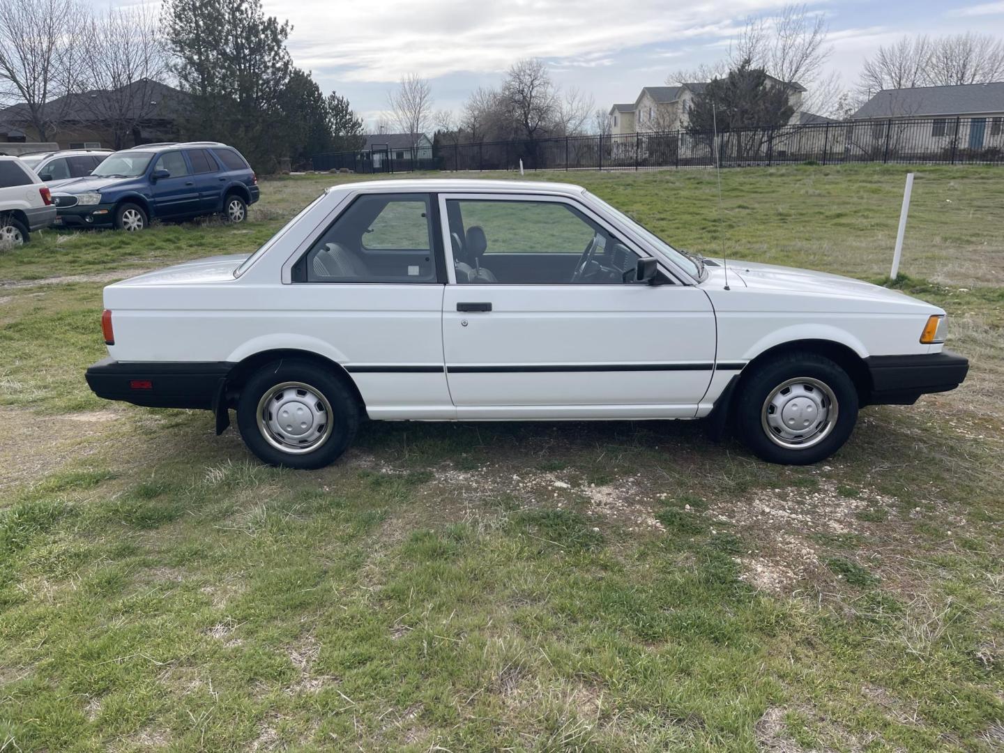 1989 White /Brown Nissan Sentra XE (JN1GB22S0KU) with an 1.6L L4 SOHC 12V engine, 5-Speed Manual Overdrive transmission, located at 813 E Fairview Ave, Meridian , ID, 83642, (208) 336-8230, 43.618851, -116.384010 - A one owner, super clean, always stored indoors, no cracks in the dash even, towels were on the seats when I got it, very very very nice unique older but spectacular vehicle. It has a 5spd with A/C that works perfectly, brand new Michellin tires. If you need a great little car for cheap this is yo - Photo#3