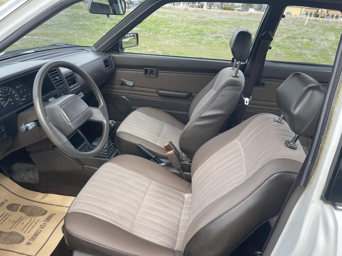 1989 White /Brown Nissan Sentra XE (JN1GB22S0KU) with an 1.6L L4 SOHC 12V engine, 5-Speed Manual Overdrive transmission, located at 813 E Fairview Ave, Meridian , ID, 83642, (208) 336-8230, 43.618851, -116.384010 - A one owner, super clean, always stored indoors, no cracks in the dash even, towels were on the seats when I got it, very very very nice unique older but spectacular vehicle. It has a 5spd with A/C that works perfectly, brand new Michellin tires. If you need a great little car for cheap this is yo - Photo#6