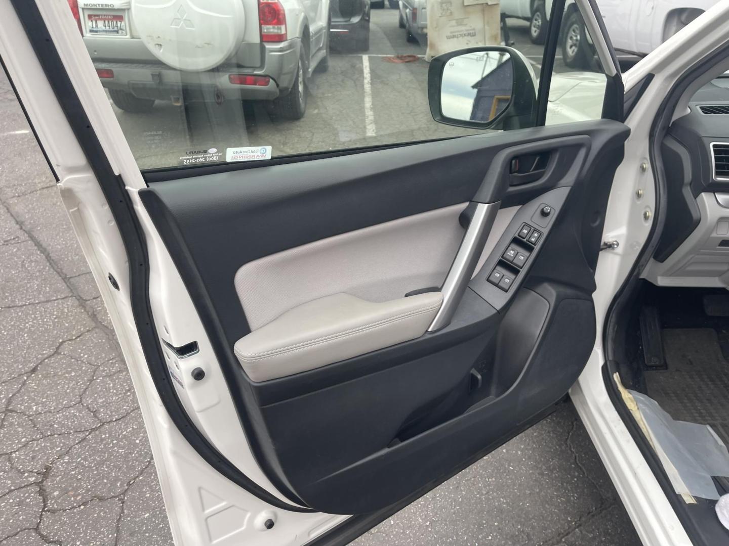 2016 White / Grey Subaru Forester 2.5i Premium PZEV CVT (JF2SJADC0GH) with an 2.5L H4 SOHC 16V engine, CVT transmission, located at 813 E Fairview Ave, Meridian , ID, 83642, (208) 336-8230, 43.618851, -116.384010 - One owner, bought in Boise, Premium with eyesight and NAV, sunroof and brand new tires, only 17k Miles. This car had towels on the seats from the day they bought it, look at the pics!!! Crazy crazy clean like brand new. Come and take a look. - Photo#6