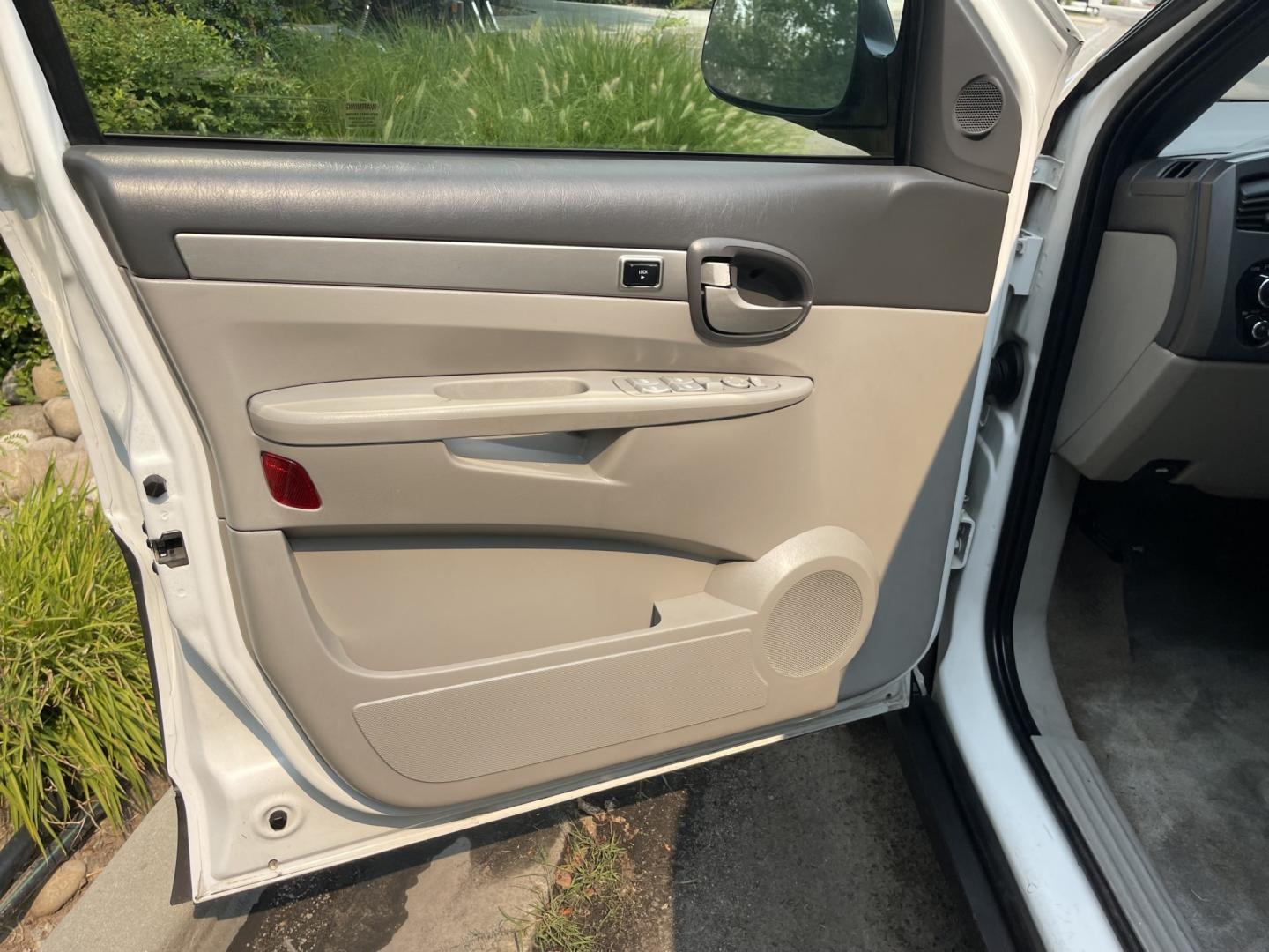 2005 White / Grey Buick Rendezvous CX (3G5DA03E65S) with an 3.4L V6 OHV 12V engine, 4A OD transmission, located at 813 E Fairview Ave, Meridian , ID, 83642, (208) 336-8230, 43.618851, -116.384010 - Runs and drives very well, A/C works perfect. If you need a cheap get around car this is a great choice.- Photo#4