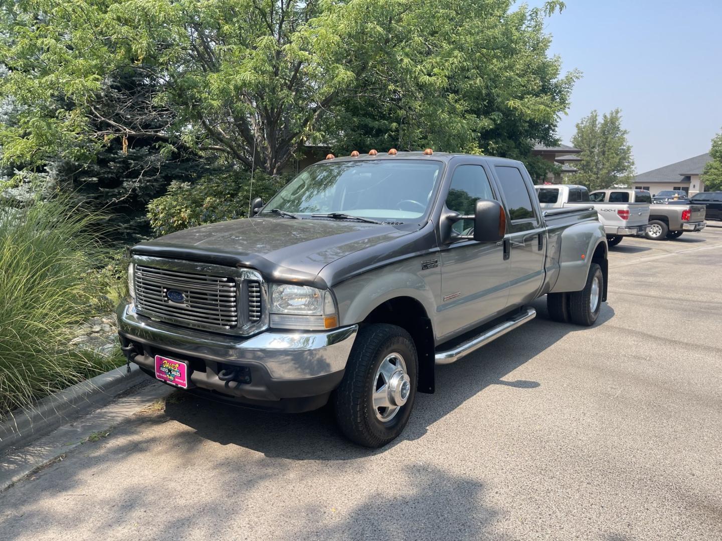 2004 Silver / Grey Ford F-350 SD Lariat Crew Cab 4WD DRW (1FTWW33P24E) with an 6.0L V8 OHV 32V TURBO DIESEL engine, AT transmission, located at 813 E Fairview Ave, Meridian , ID, 83642, (208) 336-8230, 43.618851, -116.384010 - 2004 Ford F350 Crew Cab 4x4 Lariat. Super cool pickup If you like these old Fords this is a super good one. Come check it out.- Photo#1