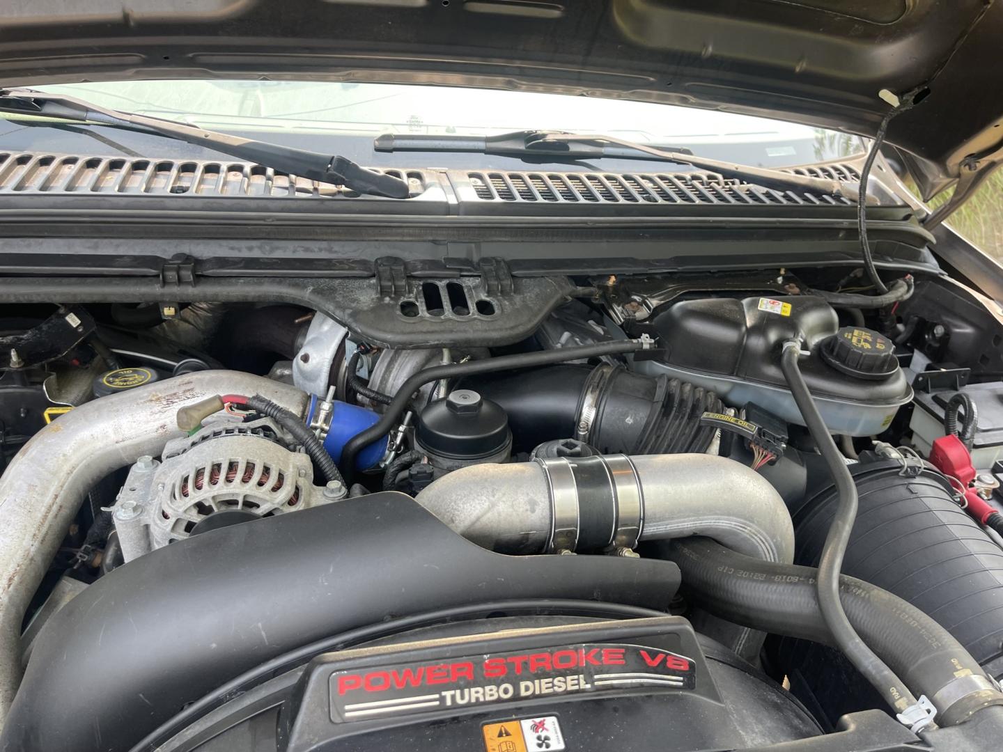 2004 Silver / Grey Ford F-350 SD Lariat Crew Cab 4WD DRW (1FTWW33P24E) with an 6.0L V8 OHV 32V TURBO DIESEL engine, AT transmission, located at 813 E Fairview Ave, Meridian , ID, 83642, (208) 336-8230, 43.618851, -116.384010 - 2004 Ford F350 Crew Cab 4x4 Lariat. Super cool pickup If you like these old Fords this is a super good one. Come check it out.- Photo#17