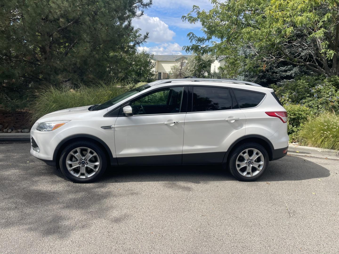 2014 White /Black Ford Escape Titanium 4WD (1FMCU9J95EU) with an 2.0L L4 DOHC 16V engine, 6-Speed Automatic transmission, located at 813 E Fairview Ave, Meridian , ID, 83642, (208) 336-8230, 43.618851, -116.384010 - 2014 Ford Escape Titanium AWD, one owner, very nice and clean, loaded with the big sunroof.- Photo#0