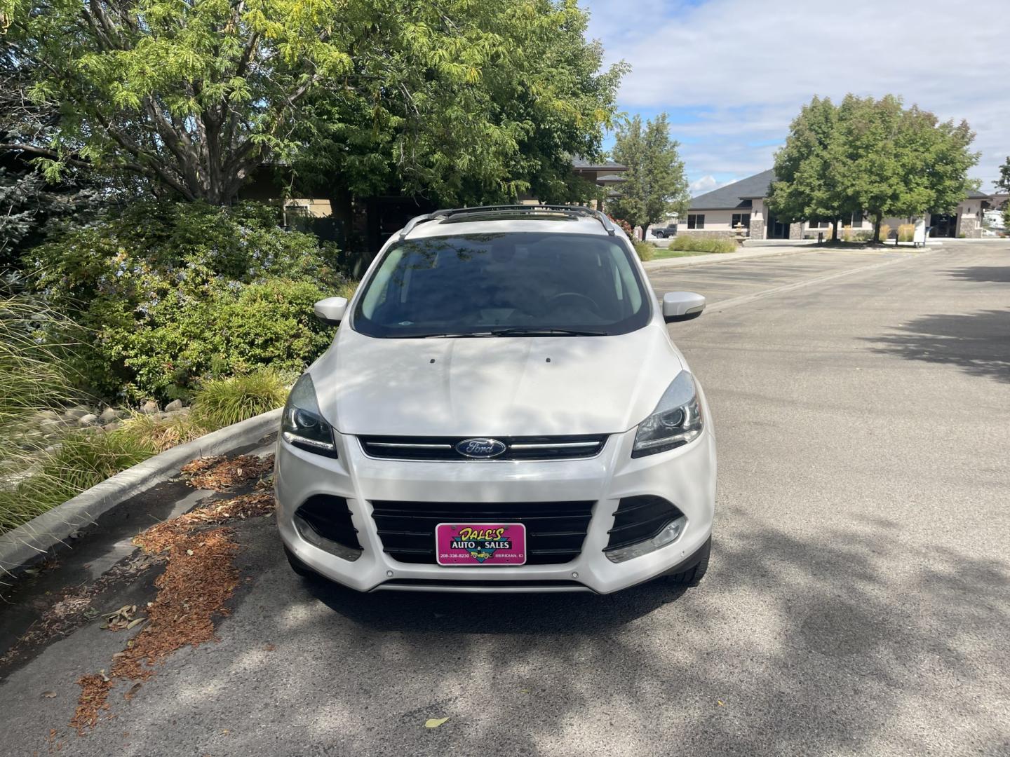 2014 White /Black Ford Escape Titanium 4WD (1FMCU9J95EU) with an 2.0L L4 DOHC 16V engine, 6-Speed Automatic transmission, located at 813 E Fairview Ave, Meridian , ID, 83642, (208) 336-8230, 43.618851, -116.384010 - 2014 Ford Escape Titanium AWD, one owner, very nice and clean, loaded with the big sunroof.- Photo#2